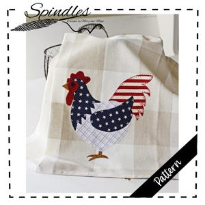May include: A cream-colored, checkered kitchen towel featuring a rooster applique. The rooster design incorporates red, white, and blue fabrics with star and stripe patterns. The word "Pattern" is visible on the image.