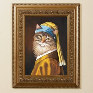 May include: A framed painting of a cat in the style of Johannes Vermeer's "Girl with a Pearl Earring." The cat wears a blue headscarf, a yellow dress, and a pearl earring. The frame is gold with ornate detailing.