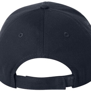May include: A navy blue baseball cap with a curved peak and an adjustable strap. The cap has a six-panel design with a button on top and ventilation eyelets. The adjustable strap is made of the same navy blue fabric.