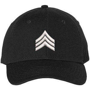 May include: A black baseball cap with a white embroidered chevron design.