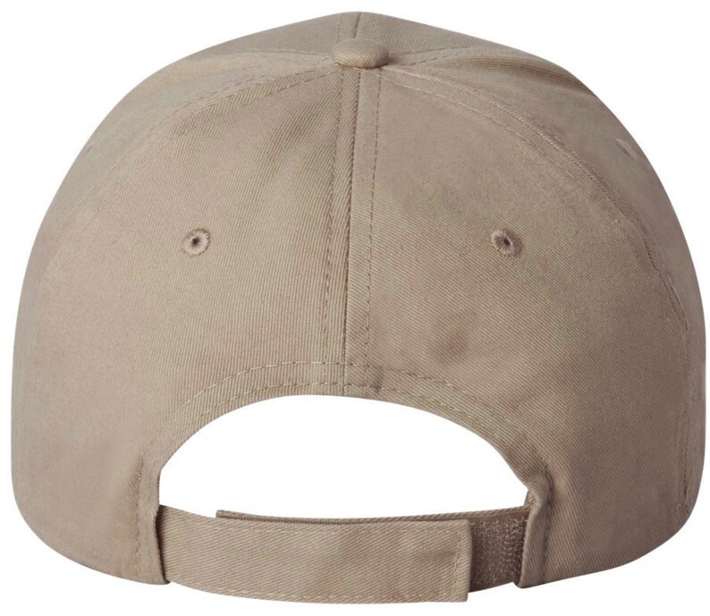 May include: A tan baseball cap, seen from the rear, with an adjustable strap and curved peak. The cap features a classic six-panel design, a button at the crown, and two small ventilation holes on each side.