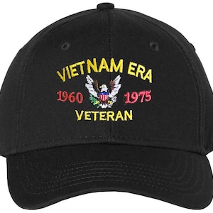 May include: Black baseball cap with embroidered text "Vietnam Era 1960-1975 Veteran" and an eagle graphic.