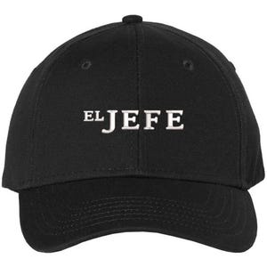 May include: A black baseball cap with a white embroidered design that says "EL JEFE".