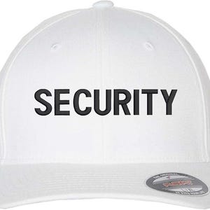 May include: White baseball cap with a black embroidered "SECURITY" text on the front.