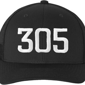 May include: Black mesh trucker hat with a white embroidered number "305" on the front.