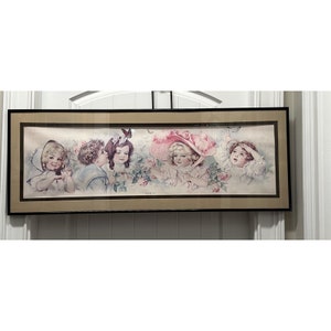 May include: A framed print of a vintage illustration featuring four children in a garden setting. The children are dressed in white and pink clothing and are surrounded by flowers and butterflies. The print is in a black frame with a gold mat.
