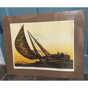 May include: A framed print of a sailboat with two people on board sailing in choppy water. The sky is a light yellow with a flock of birds flying overhead. The print is titled "Dirty Weather".
