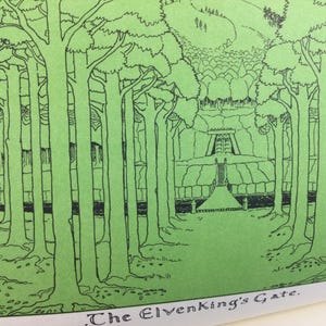May include: A green and black illustration of a forest scene with the text "The Elvenking's Gate" at the bottom. The image depicts tall trees lining a path leading to a structure in the distance. The artwork is detailed with intricate linework.