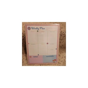 May include: A rectangular weekly planner notepad featuring a wavy, multi-colored border. The header reads Weekly Plan with a flower icon. The grid includes sections for each day of the week, plus separate boxes labeled notes and reminder.