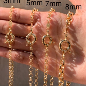May include: Gold-colored chain necklaces in 3mm, 5mm, 7mm, and 8mm thicknesses. Each chain features a round clasp. The image shows the chains held in a hand, with the sizes labeled above each chain.