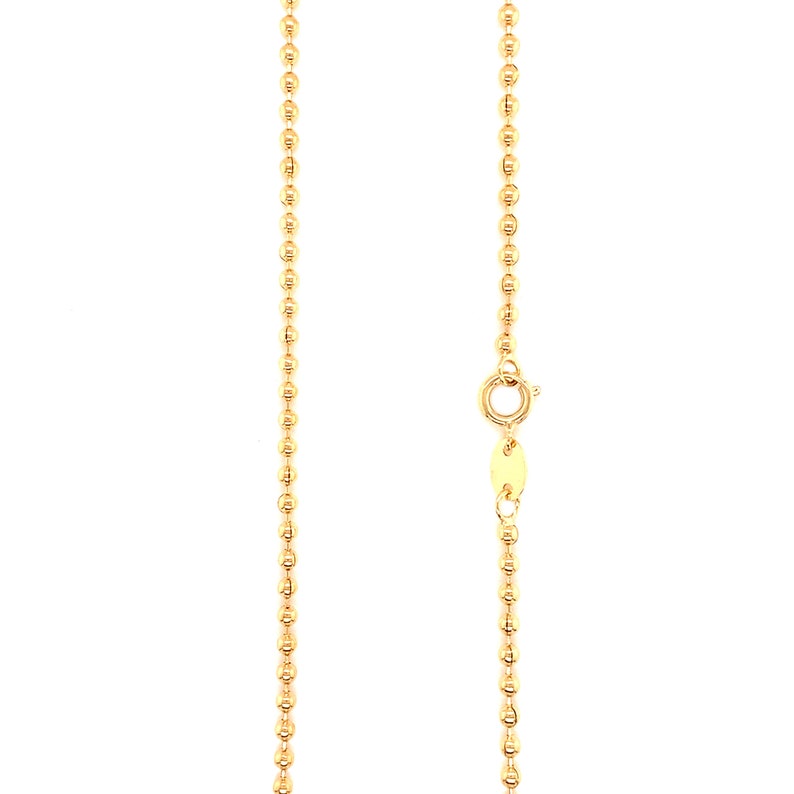 May include: A gold chain necklace with a bead design. The chain is approximately 18 inches long and features a lobster clasp.