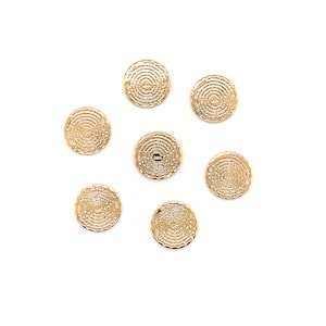 May include: Eight gold-toned metal circular charms with a textured design. Each charm has two small holes for attaching to jewelry or other crafts.