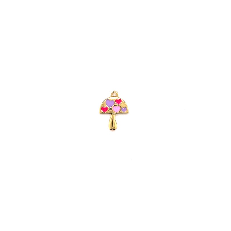 May include: A gold-colored mushroom charm with a cap decorated with pink, purple, and red heart shapes. The charm has a loop at the top for attaching to a necklace or bracelet. The mushroom stem is also gold.