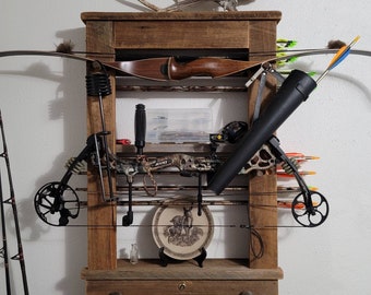 Holds 2 Bows. Custom Barnwood Archery Bow Rack made from old Barnwood to give that true rustic look. Arrows are horizontal.
