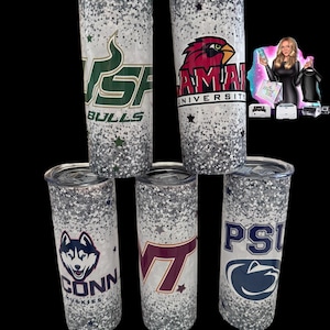 May include: Five glitter-covered tumblers with university logos. The tumblers feature logos for USF Bulls, Lamar University, UConn Huskies, Virginia Tech, and Penn State. Each tumbler has a silver glitter design with star accents.
