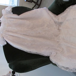 Beautiful white christening/baptism/blessing dress with lace over skirt that opens in front