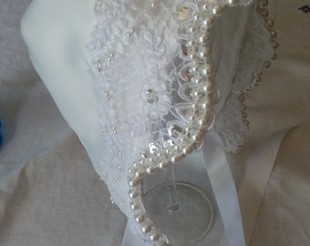 White elegant satin and lace baby bonnet with hand sewn double row of pearls