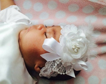 Beautiful white headband with flowers, feathers and bling on stretchy lace headband