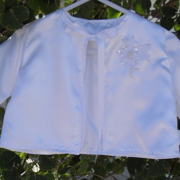 Satin baby jacket, fully lined, with pearl and sequin embellishment