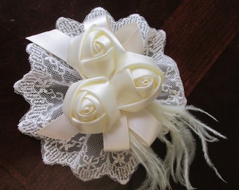 Beautiful off white barrette with silk flowers, ostrich feathers, satin ribbon on lace