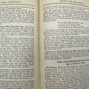May include: A vintage book with a yellowed page open to a lesson about the birth of Jesus Christ. The text includes the words "The Saviour is Born" and "Lesson for December 24".
