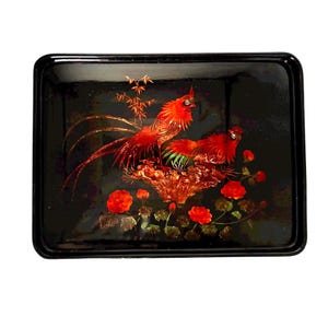 May include: Rectangular black lacquer tray with a vibrant red rooster and floral design. The tray features two roosters, red roses, and green foliage. The tray's glossy finish enhances the rich colors of the artwork.