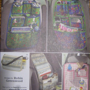 May include: A sewing pattern for a car seat organizer. The pattern includes instructions for making a variety of organizers, including a back seat organizer with multiple pockets, a front seat organizer with a pocket for a phone, and a small organizer for a baby's essentials. The pattern is designed by Robin Greenwood and is available from Simplicity.