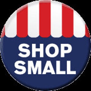 May include: A blue and red striped awning with the text "SHOP SMALL" in white letters on a blue background.