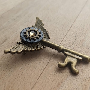 Bronze Winged Key Metal Brooch with Gear and Watch Face