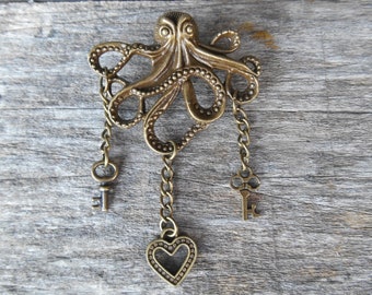 Steampunk Octopus Brooch with Heart & Keys Dangling from the Tentacles in an Antiqued Bronze Finish