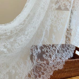 White Chantilly lace fabric with flowers for bridal veil, wedding dress