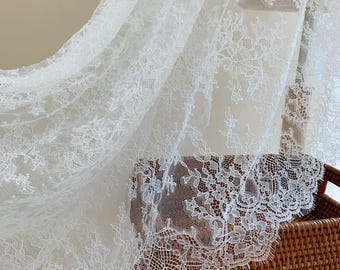White Chantilly lace fabric with flowers for bridal veil, wedding dress