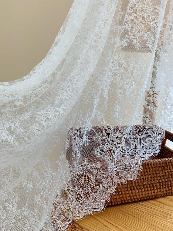 White Chantilly lace fabric with flowers for bridal veil, wedding dress