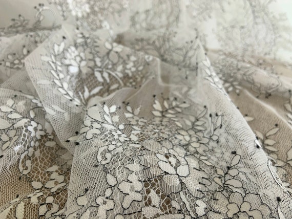 white Chantilly lace fabric with black florals