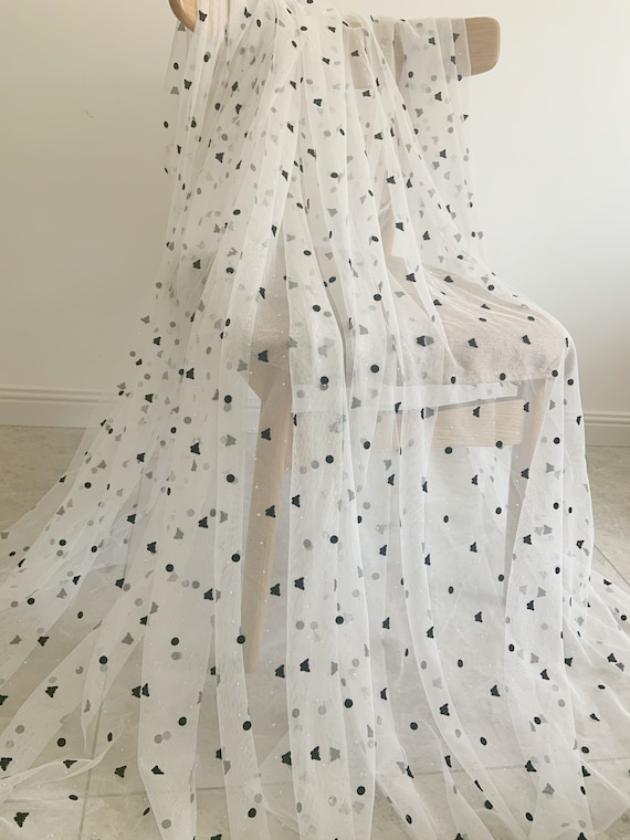 Off white tulle fabric with black velvet butterfly dots and rhinestones for prop, dress, costume