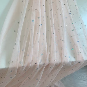 Peach tulle fabric with sparkling sequins