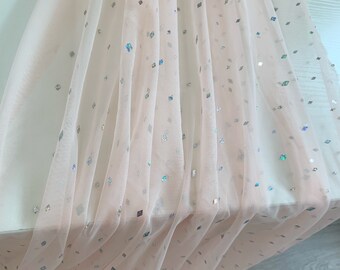 Peach tulle fabric with sparkling sequins