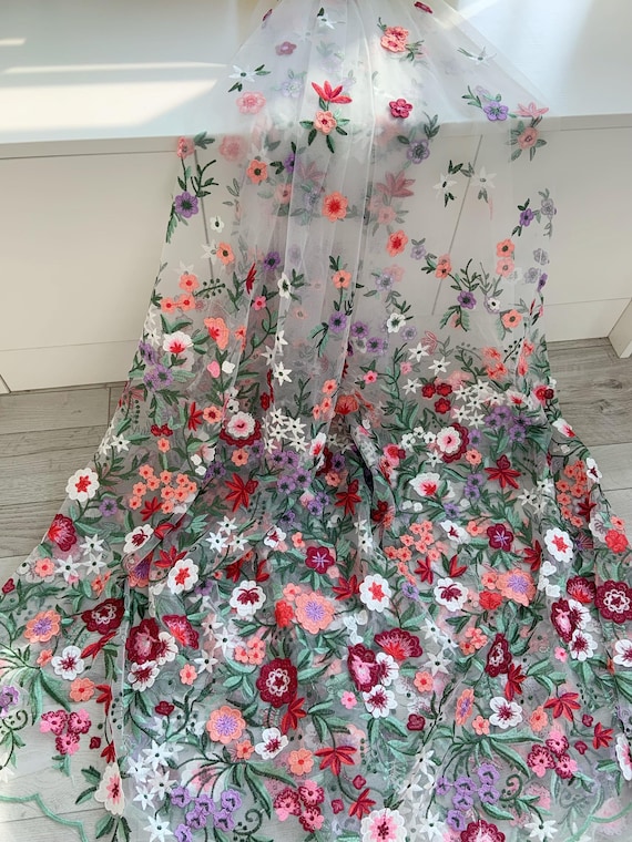 Colorful embroidered tulle lace fabric with flowers and green leaves for dress skirt
