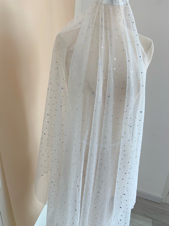 Off white tulle fabric with sparkling sequins