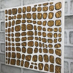 May include: Abstract painting on canvas with a white background and gold textured circles. The circles are arranged in a pattern resembling scales.
