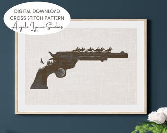 Pode incluir: Padrão de ponto cruz para download digital que representa uma silhueta de um revólver com uma cena de floresta dentro do cano. O padrão é intitulado "Angela Jynne Studios".