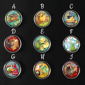May include: Ten round, colourful, ceramic buttons with images of chickens, eggs, and a coop. The buttons have a silver metal rim.
