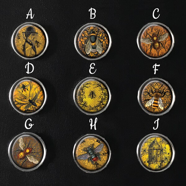 May include: Ten round, gold-colored metal buttons with different bee-themed designs. Each button has a letter label from A to J.