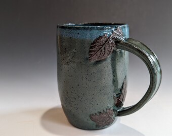 green and teal leaf mug