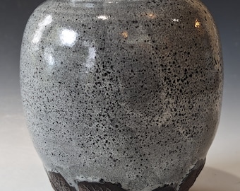 gray vase with leafy base