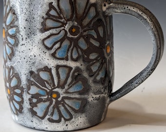 gray mug with blue asters