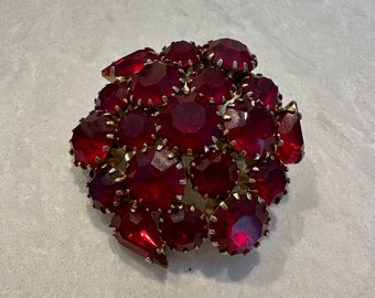 Red high dome brooch with faceted stones circa 1960s