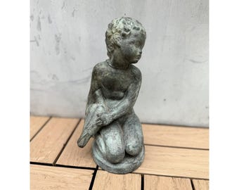 Amphora Ceradona Spain  a bronze effect ceramic  figure kneeling holding a bird