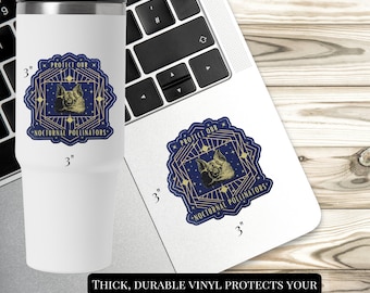May include: A white travel mug and a sticker featuring a bat illustration and the text "PROTECT OUR NOCTURNAL POLLINATORS." The sticker is 7.6 cm in diameter. The text at the bottom says "THICK, DURABLE VINYL PROTECTS YOUR STICKERS FROM SCRATCHES, WATER & SUNLIGHT."