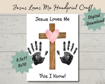 May include: Printable digital download of a handprint craft with a brown wooden cross and a pink heart. The text "Jesus Loves Me This I Know!" is printed below the cross. The craft is available in 8.5x11 and 8x10 sizes.